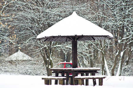 Picnic table covered with snow during winter at Kosutnjak park, Belgrade, Serbiaの写真素材