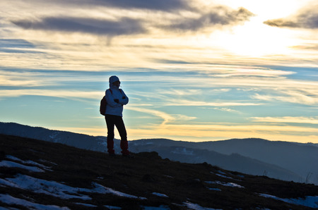 Hiker on mountain Stolovi before sunset at early spring, Serbiaの写真素材