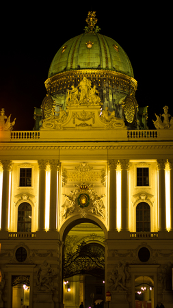 Gate and entrance in front of Hofburg palace at night, Vienna, Austriaのeditorial素材