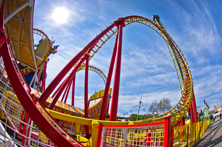 Super wide view of a colorful roller coaster in Prater amusement park at Vienna, Austriaの写真素材
