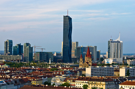 Vienna skyline at sunset, contrast between modern skycrapers and old style buildings, Austriaの写真素材