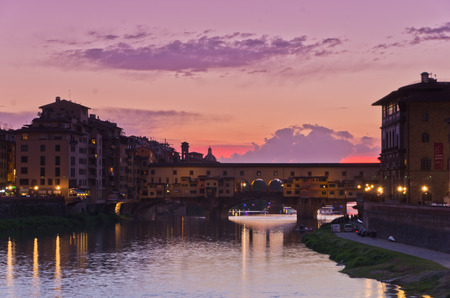 Ponte Vecchio bridge in Florence at sunset, Tuscany, Italyの写真素材