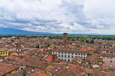 Cityscape of Lucca with Guinigi tower in background, Tuscany, Italyの写真素材