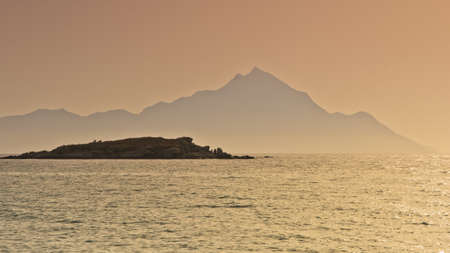 Sunrise at the beach near holy mountain Athos, Chalkidiki, Greeceの写真素材