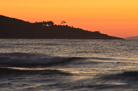Sunrise and waves at golden beach, Thassos island in Greeceの写真素材