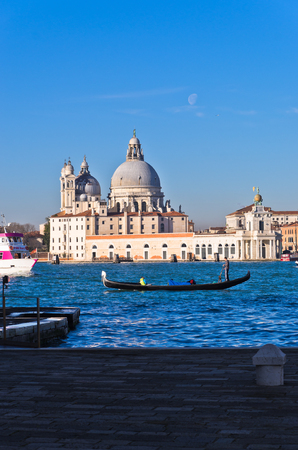 Morning in Venice, gondolas, Grand Canal and Santa Maria della Salute church, Italyの写真素材