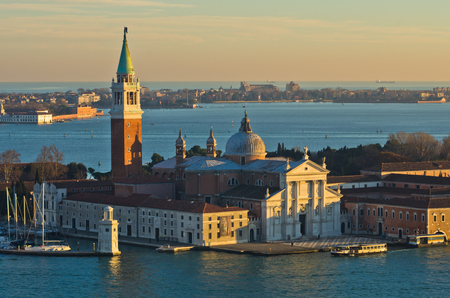 Sunset in Venice, telephoto aerial view of San Giorgio Maggiore church accross Grand Canal, Italyの写真素材