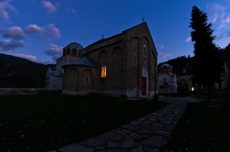 Church inside 12.century Studenica monastery during evening prayerの写真素材