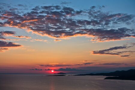 Sunset at Toroni bay with Turtle island in background, Sithonia, Greeceの写真素材