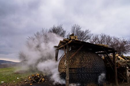 Traditional coal making process on a cloudy autumn day in east Serbiaの写真素材