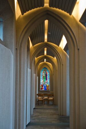 Stained glass at the of corridor with arches inside Hallgrimskirkja, Reykjavik cathedral, Icelandのeditorial素材