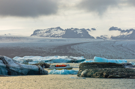 Icebergs from Vatnajokull are melting at Jokulsarlon glacier lagoon and floating to Atlantic ocean...