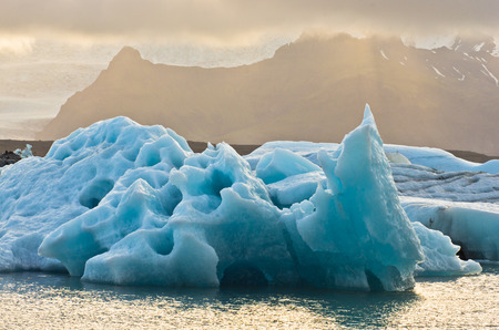 Icebergs from Vatnajokull are melting at Jokulsarlon glacier lagoon and floating to Atlantic ocean...