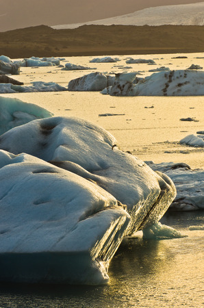 Icebergs from Vatnajokull are melting in Jokulsarlon glacier lagoon and floating to Atlantic ocean...