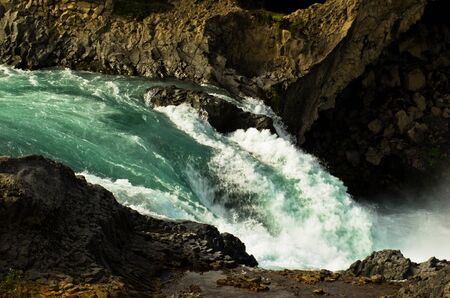 Glacial river leading from Godafoss waterfall, north Iceland