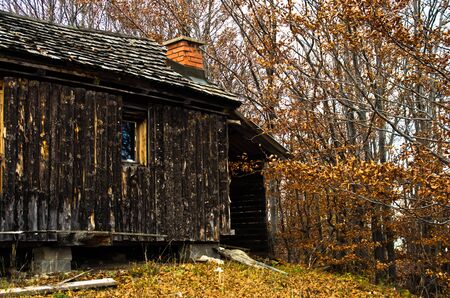 Old wooden cabin at autumn sunset, Bobija mountain, west Serbiaのeditorial素材