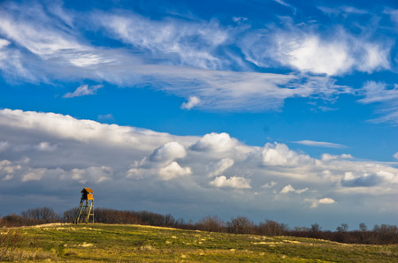 Hunting watchtower on a meadow at sunny autumn day, Deliblatska pescara, Serbiaの写真素材