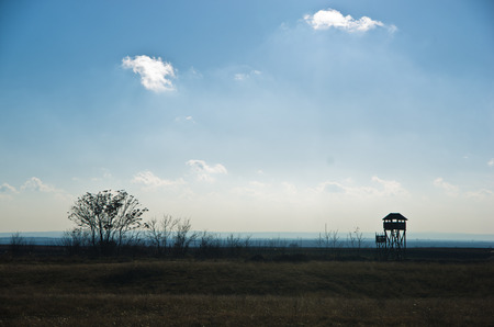 Hunting watchtower on a meadow at sunny autumn day, Deliblatska pescara, Serbiaの写真素材