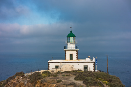 Akrotiri lighthouse at sunny morning with picturesque clouds, Santorini island, Greeceの写真素材