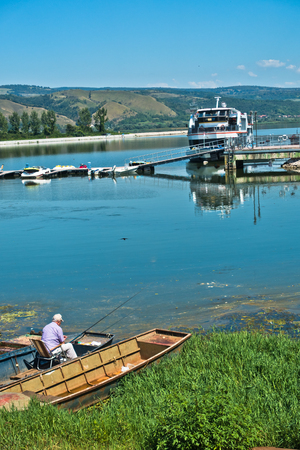 Fisherman on a calm sunny morning at Danube river in Serbiaの写真素材