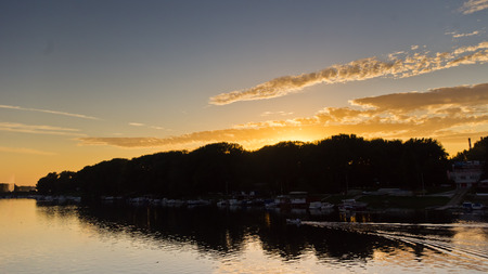 Boat on a lake Ada channel at sunset in Belgrade, Serbiaの写真素材