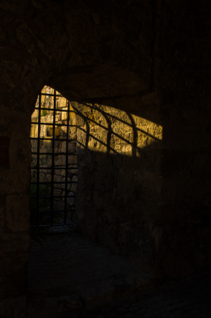 Sunlight through the dungeon bars at Kalemegdan fortress, Belgrade, Serbiaの写真素材