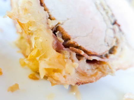 Detail of a beef Wellington slice in a white plateの写真素材