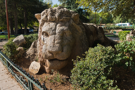 Stone lion monument in Ifrane is a cult landmark in mid Atlas, Morroco, Africaの写真素材