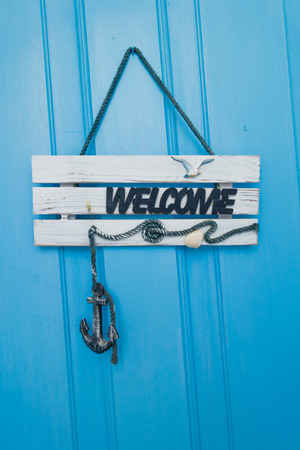 Welcome sign at apartment doors near Panormos at the island of Skopelos, Greeceの写真素材