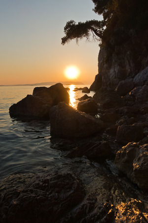 Sihouette of a rocks at sunset, Kastani Mamma Mia beach, island of Skopelos, Greeceの写真素材