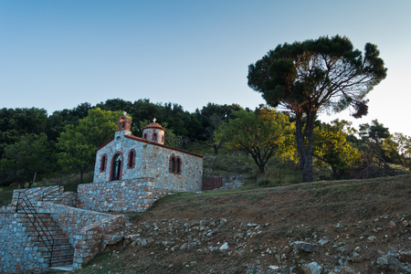 Small church on a hill over Skopelos town at sunrise, island of Skopelos, Greeceの写真素材