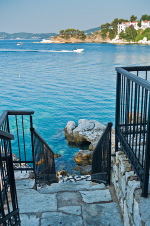 View from stairway to rocks at Skiathos bay, morning at Skiathos island, Greeceのeditorial素材