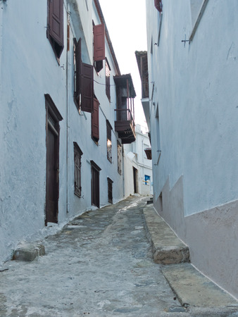 Narrow alleys with traditional greek houses at Skopelos old town, sunset at Skopelos island, Greeceの写真素材