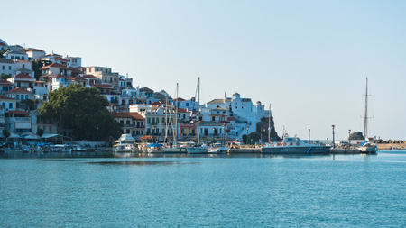 Skopelos harbor and town before sunset, island of Skopelos, Greeceの写真素材
