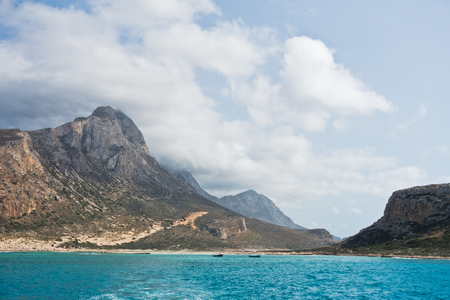 Balos beach with surrounding landscape, view from a ship at north-west coast of Crete island, Greeceの写真素材