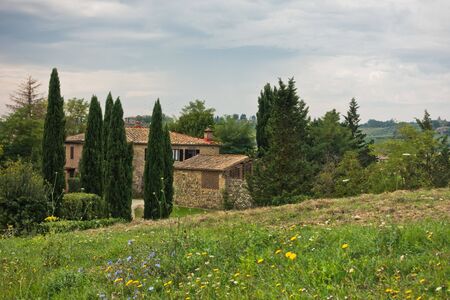 Hiking hills, backroads and vineyards at autumn, near Siena in Tuscany, Italyの写真素材