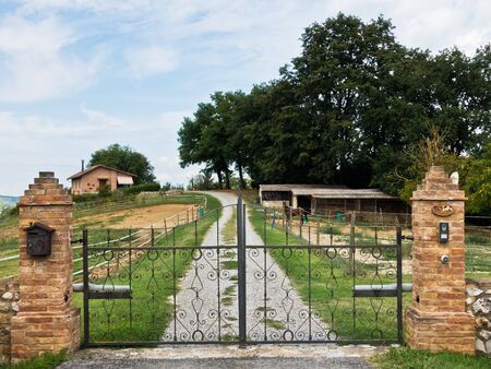 Hiking backroads of Tuscany near beautiful villas at Monaciano, near Siena, Italy