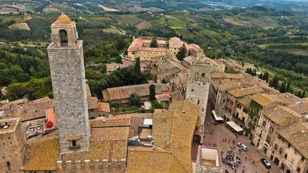 Panoramic aerial view of the city and surrounding countryside from the towers of San Gimignano in Tuscany, Italyの写真素材