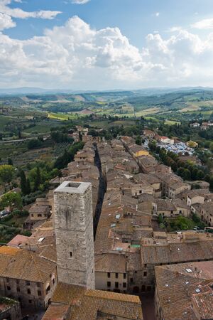 Panoramic aerial view of the city and surrounding countryside from the towers of San Gimignano in Tuscany, Italyの写真素材