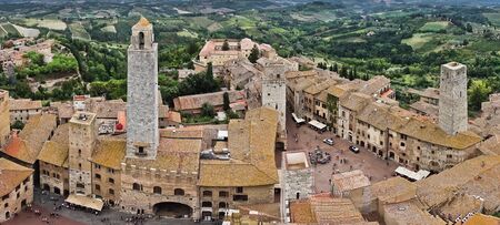 Panoramic aerial view of the city and surrounding countryside from the towers of San Gimignano in Tuscany, Italyの写真素材