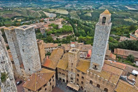 Panoramic aerial view of the city and surrounding countryside from the towers of San Gimignano in Tuscany, Italyの写真素材