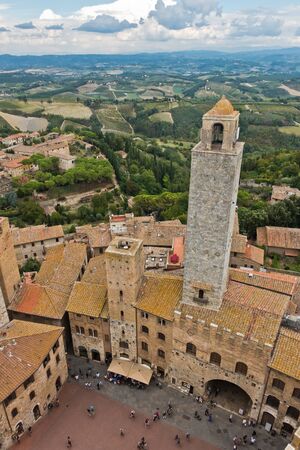 Panoramic aerial view of the city and surrounding countryside from the towers of San Gimignano in Tuscany, Italyの写真素材