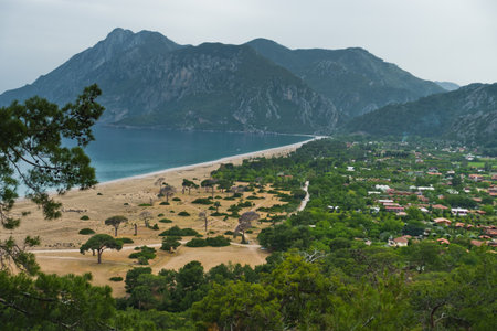 Cirali beach and its surrounding mountain landscape at Olympos national park in Turkeyの写真素材