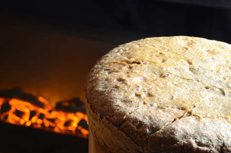 Domestic bread with fireplace in a background