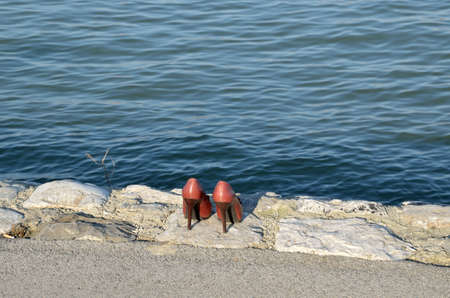 Feminine high heels a river bankの写真素材