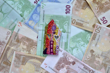 Banknotes as a background and a houseの写真素材