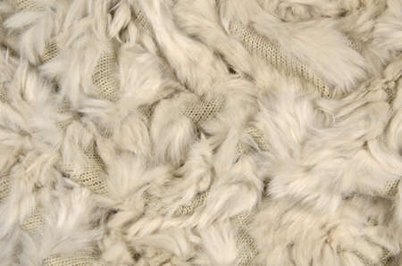 Beige wool - fur combination, as a background.