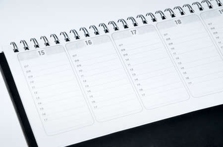 Rustic agenda with metal spiral and marked dates and hours