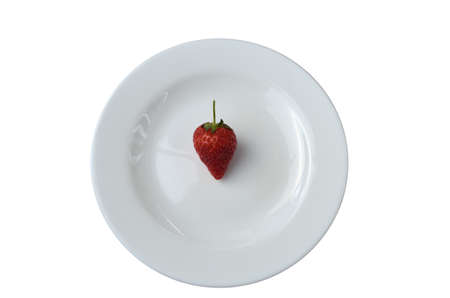 White plate with a strawberry isolated on a white backgroundの写真素材