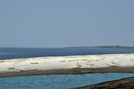 Part of white wooden fence and sea viewの写真素材